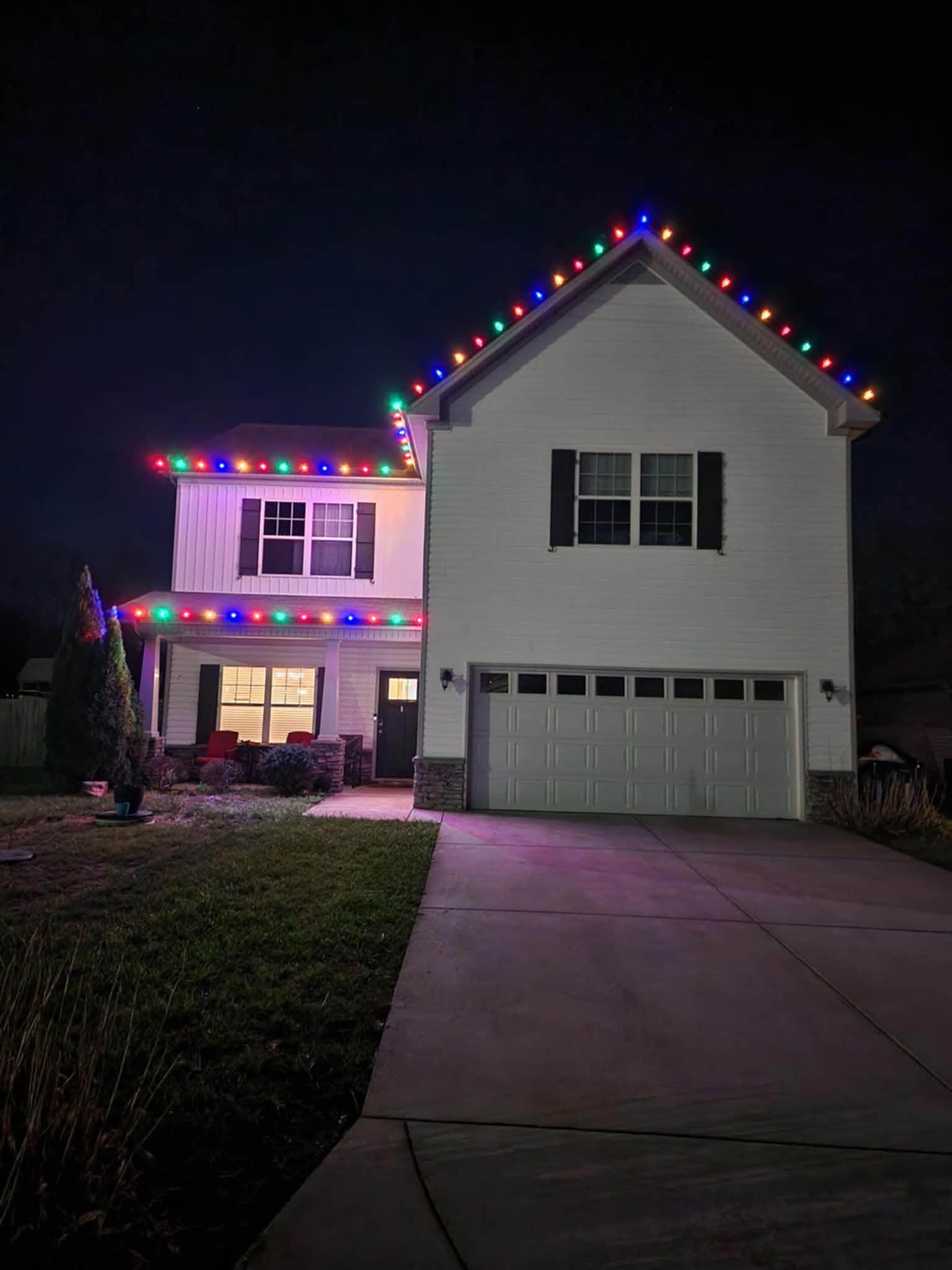 Colorful C9 Christmas lights on a two-story home in Gallatin, TN